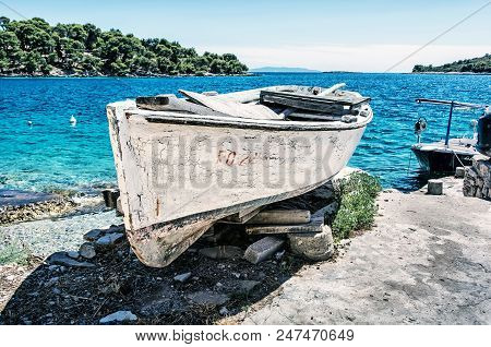 Old Fishing Boat With Cracked White Paint, Solta Island, Croatia. Travel Destination. Mediterranean 