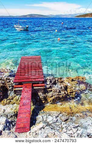 Beautiful Mediterranean Sea, Solta, Croatia. Summer Vacation. Springboard, Turquoise Water And Littl