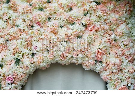 Flower Garland On The Wall. Dense Wall Of Flowers. Wedding Photo Zone. Romantic Space Decor