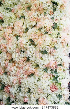 Flower Garland On The Wall. Dense Wall Of Flowers. Wedding Photo Zone. Romantic Space Decor
