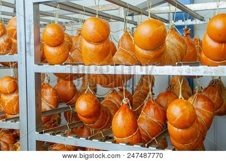 Sausage. Sausage Production Line. Sausage On The Counter For The Smokehouse. Industrial Manufacture