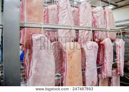 Pork. The Line For The Production Of Smoked Delicacies. Industrial Manufacture Of Sausage Products.