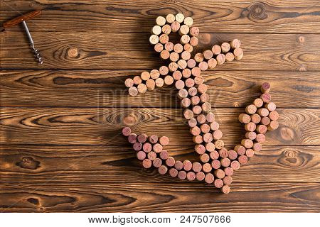 Creative Wine Cork Still Life In The Shape Of A Ships Anchor On A Rustic Wood Background With Corksc