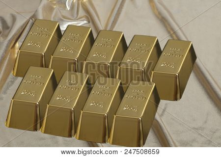 Stacked Bars Of Gold Bullion On Golden Brocade Fabric.financial Concept