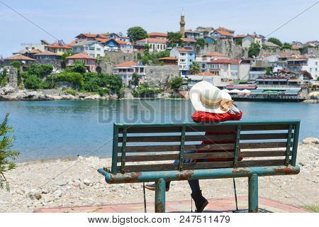 A tourist enjoys amazing view of Historical Amasra - Amasra town, Bartin - Turkey