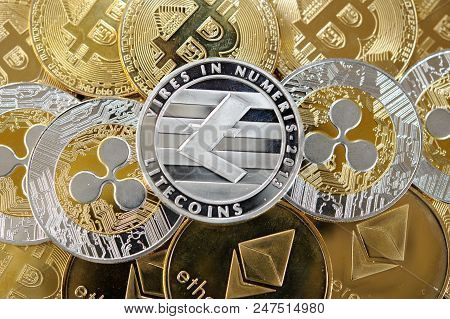 Lots Of  Bitcoins, Litecoins, Etherum, Ripple Coins. Golden And Silver Coins Combination