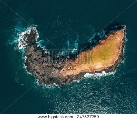 Aerial top view of small island, Bukit Asah, new tourist attraction of tropical island Bali, Indonesia