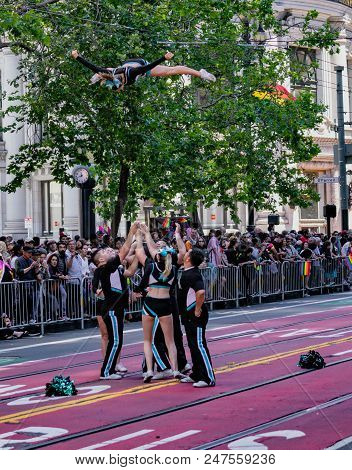 Gay Pride Parade In San Francisco - Acrobats Perform Aerial Stunts While Marching