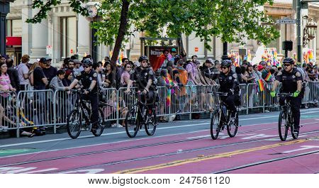 Gay Pride Parade In San Francisco - Police Ride Bicycles Ahead Of The Parade, Checking For Any Probl