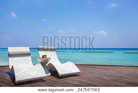 Deckchair And Beautiful Turquoise Indian Ocean In Maldives