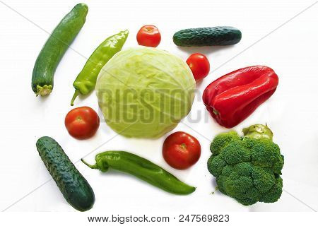Mix Of Vegetables On White Back Ground. Tomatoes, Green Pepper, Red Pepper, Lettuce, Broccoli And Zu