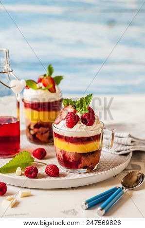 Fruit Cake, Jelly, Custard, Berry And White Cocolate Whipped Cream Individual Trifles, Copy Space Fo