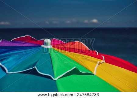 Colourful Umbrella On The Beach And Sea Water
