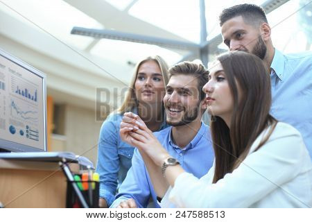 Group Of Young Modern People In Smart Casual Wear Having A Brainstorm Meeting While Standing In The 
