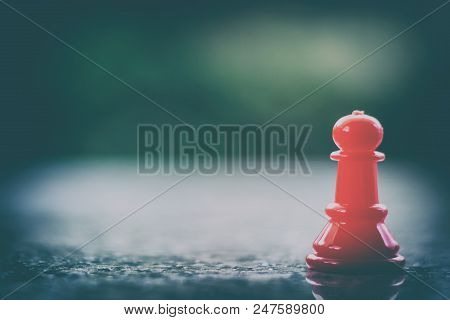 Red Chess Pawn On Dark Tone Background For Leadership And Business Strategy Concept