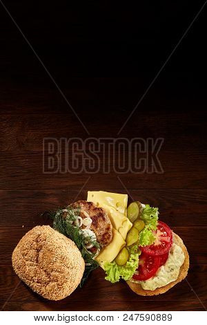 Close-up Of Delicious Fresh Home Made Burger With Piccoli, Lettuce, Cheese, Onion, Tomato, Dill And 