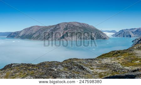 Mist Over Glacier In A Sunny Day Near Narsarsuaq