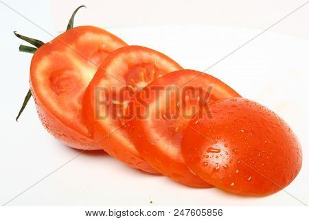 Fresh Organic Sliced Tomato On White Background. Top View