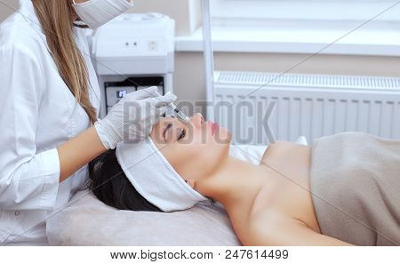 The Doctor Cosmetologist Makes The Rejuvenating Facial Injections Procedure For Tightening And Smoot