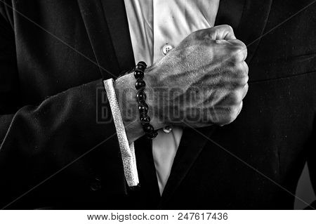 Male Hand With Veiny Skin. Man Wearing White Shirt And Black Jacket. Businessman Clenching Fist. Pra