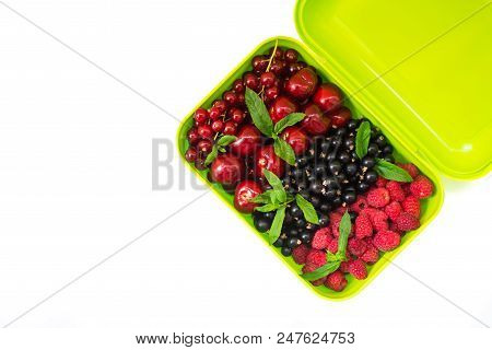 Berry Mix: Cherry, Red And Black Currant, Raspberry In A Light Green Container.