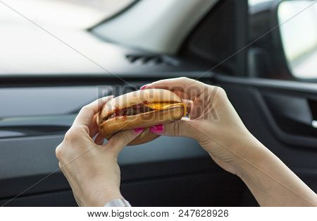 Beautiful Girl Holding A Cheeseburger With Her Hands, Close-up