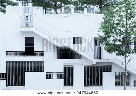 Abstract Facade Surrounded By Trees, Architectural Background - Grille Windows Different Shapes And