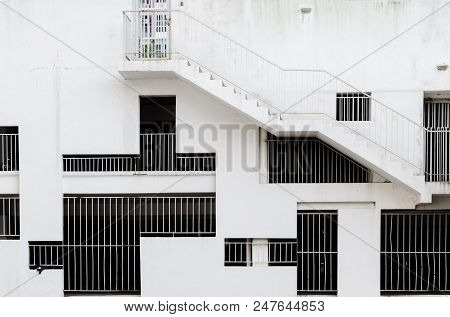 Abstract Exterior Architectural Background - Grille Windows Of Different Shapes And Sizes At White C