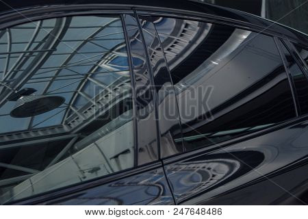Tinted Black Car Windows That Reflect The Glass Ceiling