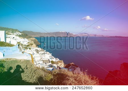 Gourgeous View From White Walled Resort In Santorini, Greece, With Ocean, Cliffs And Caldera Of Sant