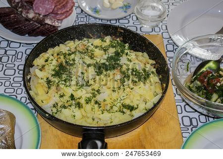 Fried Potatoes On An Iron Frying Pan