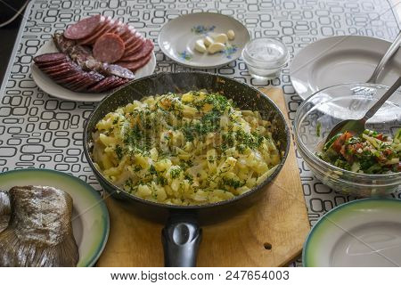 Fried Potatoes On An Iron Frying Pan