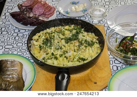 Fried Potatoes On An Iron Frying Pan