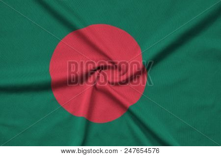 Bangladesh Flag  Is Depicted On A Sports Cloth Fabric With Many Folds. Sport Team Waving Banner