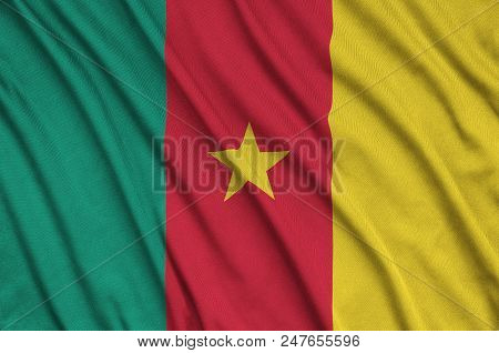Cameroon Flag  Is Depicted On A Sports Cloth Fabric With Many Folds. Sport Team Waving Banner