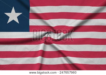 Liberia Flag  Is Depicted On A Sports Cloth Fabric With Many Folds. Sport Team Waving Banner