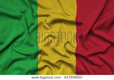 Mali Flag  Is Depicted On A Sports Cloth Fabric With Many Folds. Sport Team Waving Banner