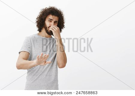You Stink, Do Not Come Closer. Portrait Of Disgusted Disliking Handsome Guy With Afro Hairstyle, Til