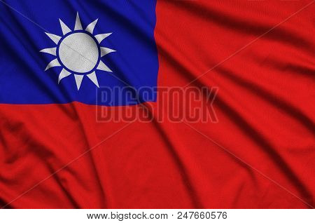 Taiwan Flag  Is Depicted On A Sports Cloth Fabric With Many Folds. Sport Team Waving Banner