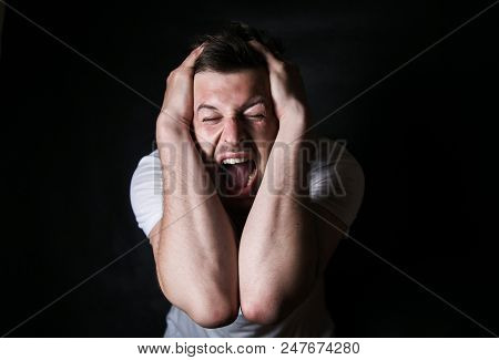 Portrait Of A Young Evil Person On A Black Background, Problems In The Family, Conflation At Work, N