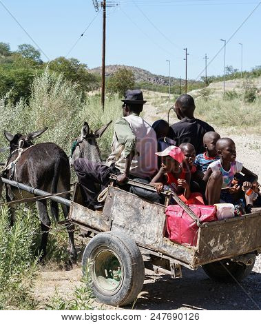 Khohaxis, Namibia - May 21 2018;  Donkey Cart Arrives At Rural Country Area Stop To Collect School C