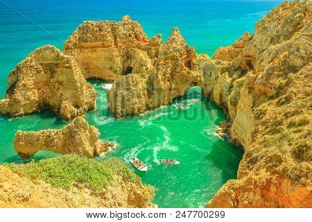 Aerial View Of Scenic Landscape Of Boat Trip Between Cliffs And Natural Rock Formations Of Ponta Da 