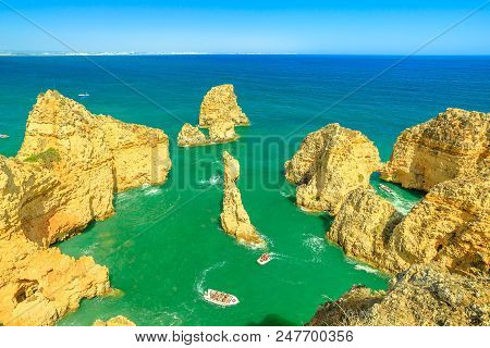 Aerial View Of Scenic Landscape Of Boat Trip Between Cliffs And Natural Rock Formations Of Ponta Da 