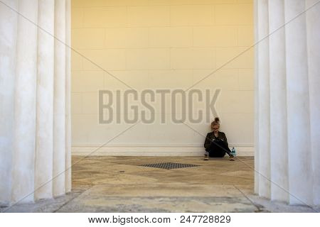 Vienna, Austria - May, 22: Nice Girl Reading A Book Next To The Columns Of The Theseus Temple On May