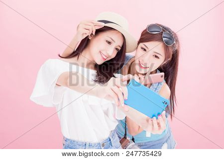 Two Travel Woman Selfie Happily With Travel Concept On The Pink Background