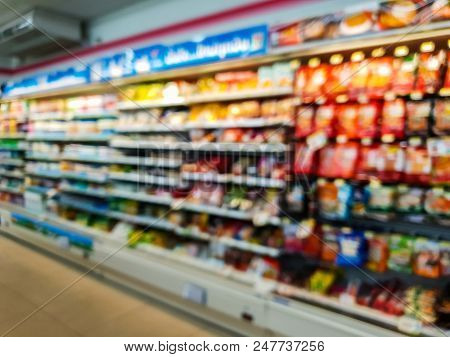 Lurred Abstract Of Chips, Snacks On Shelves Display At Mini Mart Store