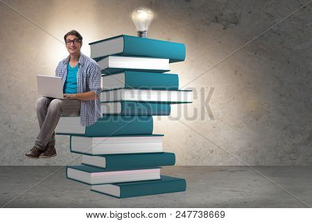 Young man in telelearning concept with laptop and books