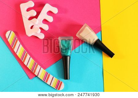 Manicure Or Pedicure Concept With Nail Polish, Colorful Background