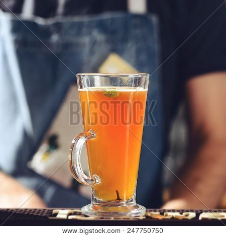 Hot Alcoholic Cocktail Grog At Glass At The Bar Counter, Selective Focus