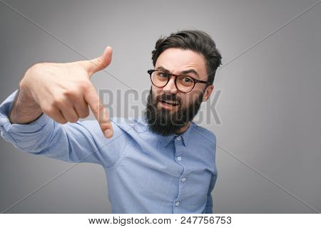 Bearded Guy In Eyeglasses And Shirt Looking Overconfident And Bully Pointing With Finger Down And Lo